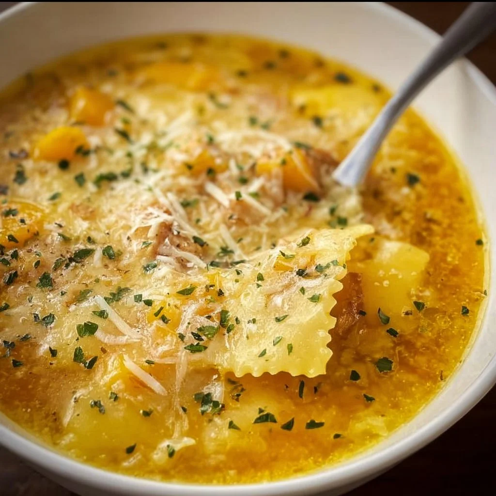 Delicious bowl of butternut squash lasagna soup topped with cheese and herbs