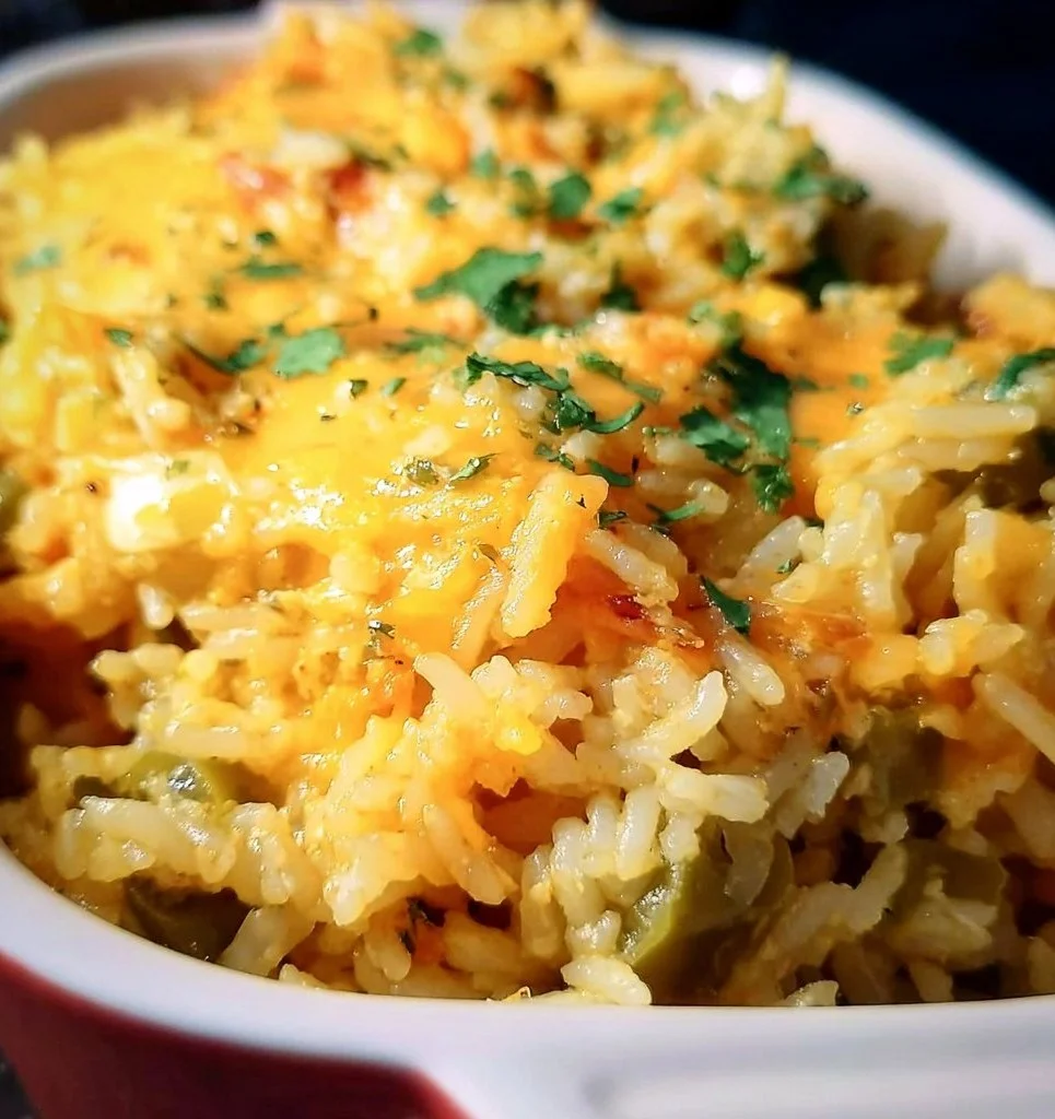 Cheesy Green Chili Rice dish with fresh herbs and spices.