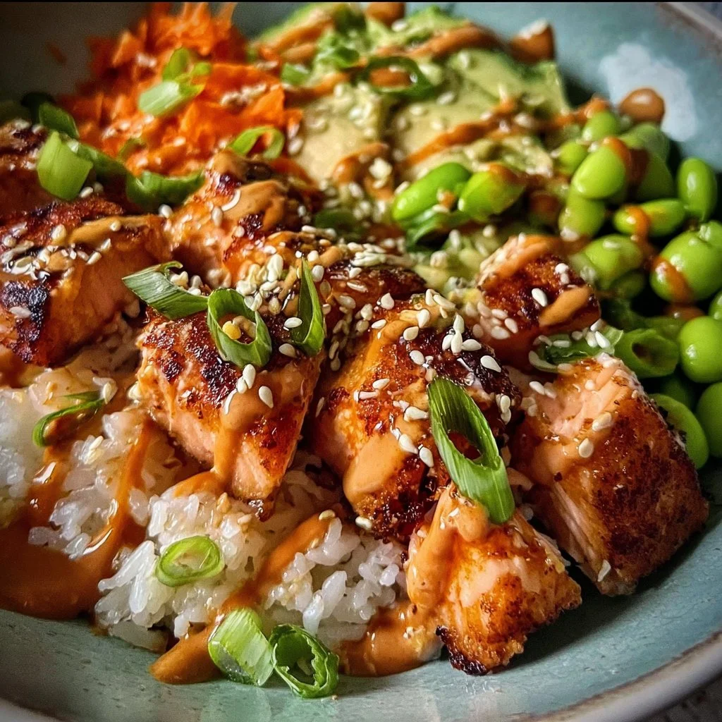 Honey Sriracha Salmon Bowls with fresh vegetables and rice