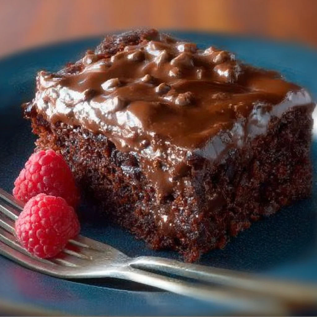 Delicious slice of Mexican Chocolate Cake topped with chocolate and spices.