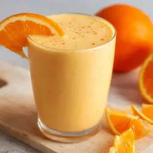 Delicious Orange Creamsicle Smoothie in a glass with orange slices